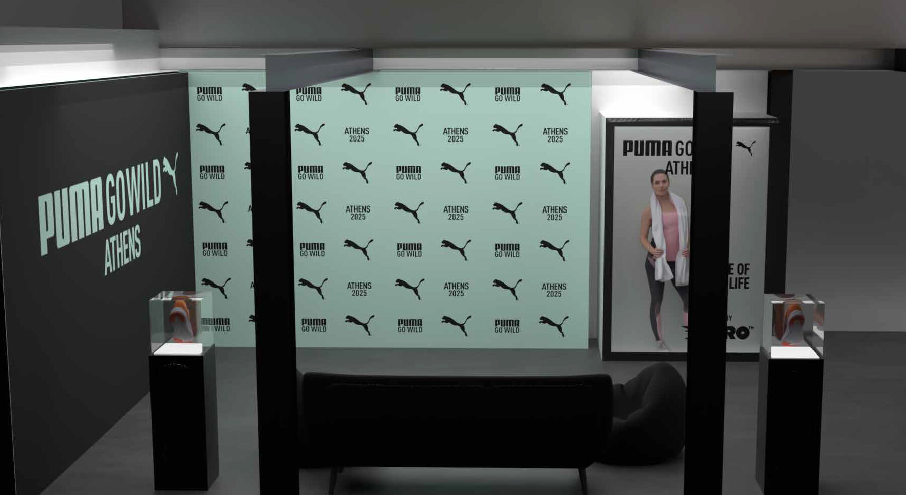 Mint step-and-repeat photo wall with a sofa, bean bag and two shoe display cases.